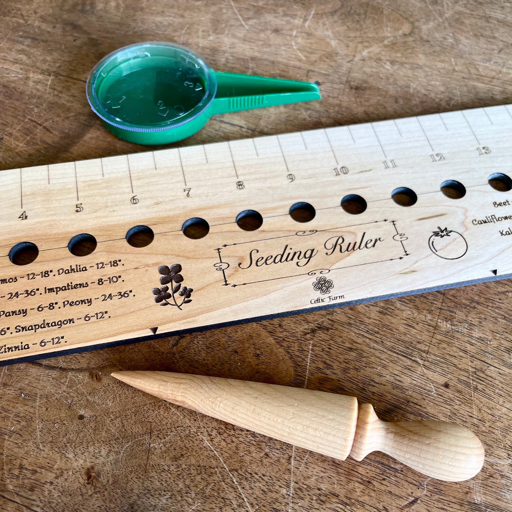 Celtic Farm seeding gift set with dibble, seeder, and ruler, garden tools for planting and soil measurement.