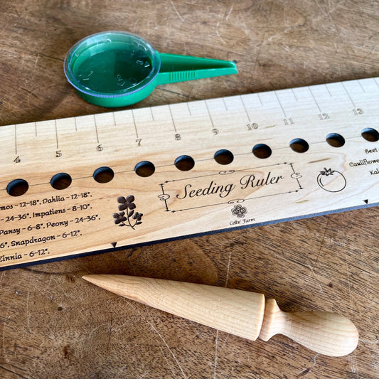 Celtic Farm seeding gift set with dibble, seeder, and ruler, garden tools for planting and soil measurement.