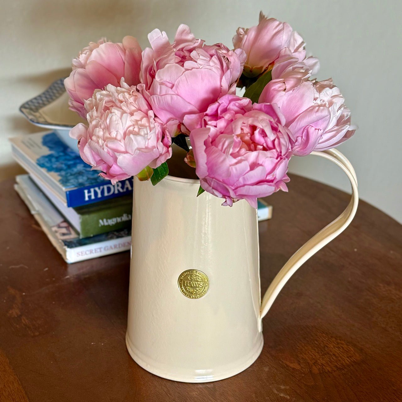 Cream-colored Haws Watering Pitcher from The Celtic Farm, a traditional watering can with a curved spout for easy watering.