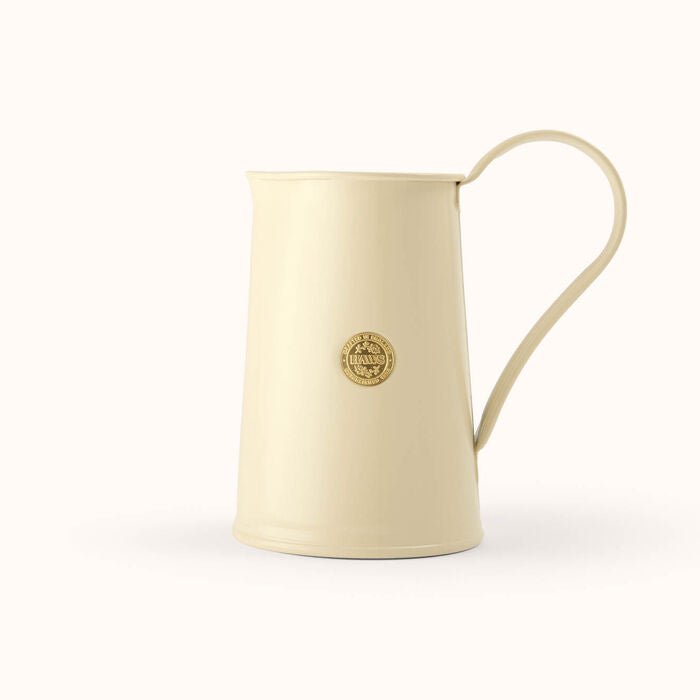 Cream-colored Haws Watering Pitcher from The Celtic Farm, a classic watering can for garden and plant watering.