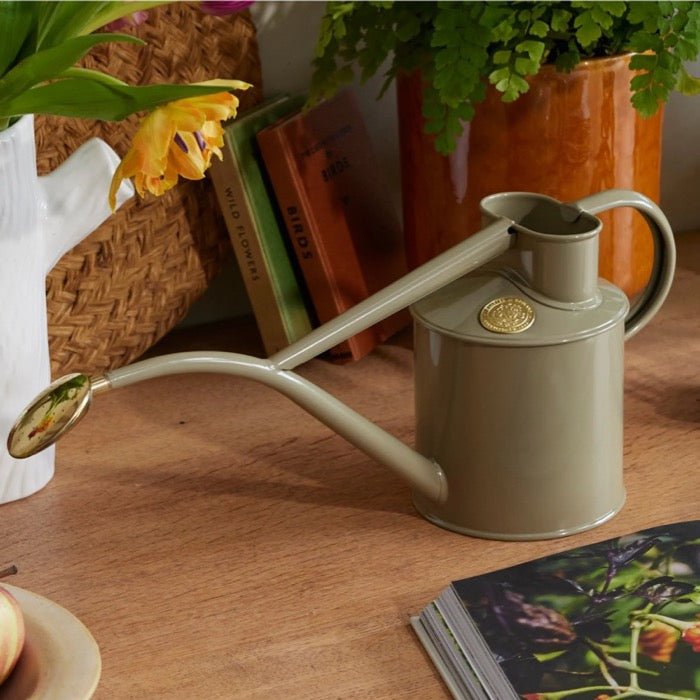 Dark green Haws Rowley Ripple watering can by The Celtic Farm, with a classic design and curved handle for easy watering.