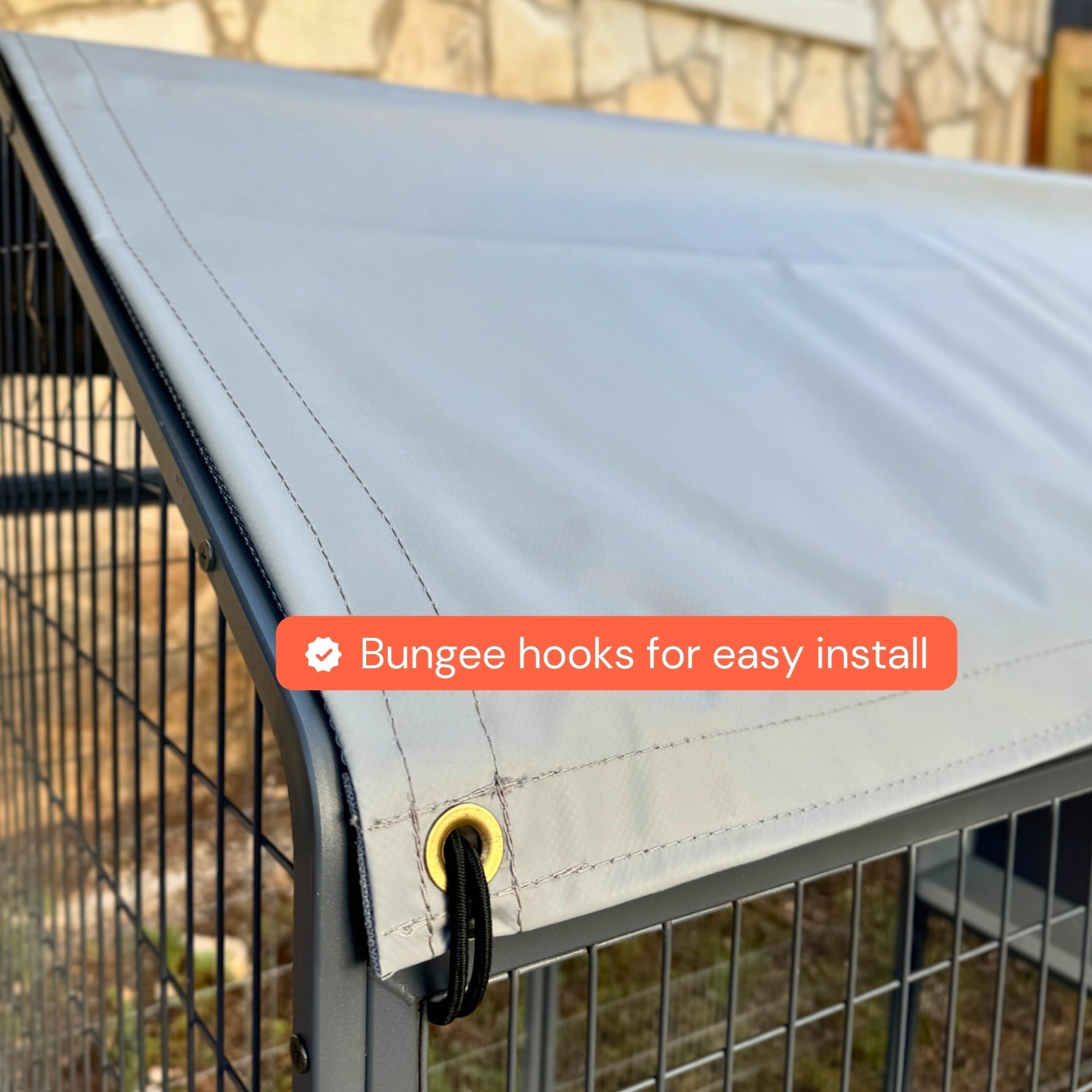 All-weather coop tarp by The Smart Coop covering a chicken coop, providing protection from rain and wind.