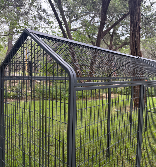 The Smart Coop extended range run add-on for chicken coop, showing a spacious outdoor enclosure with wire fencing.