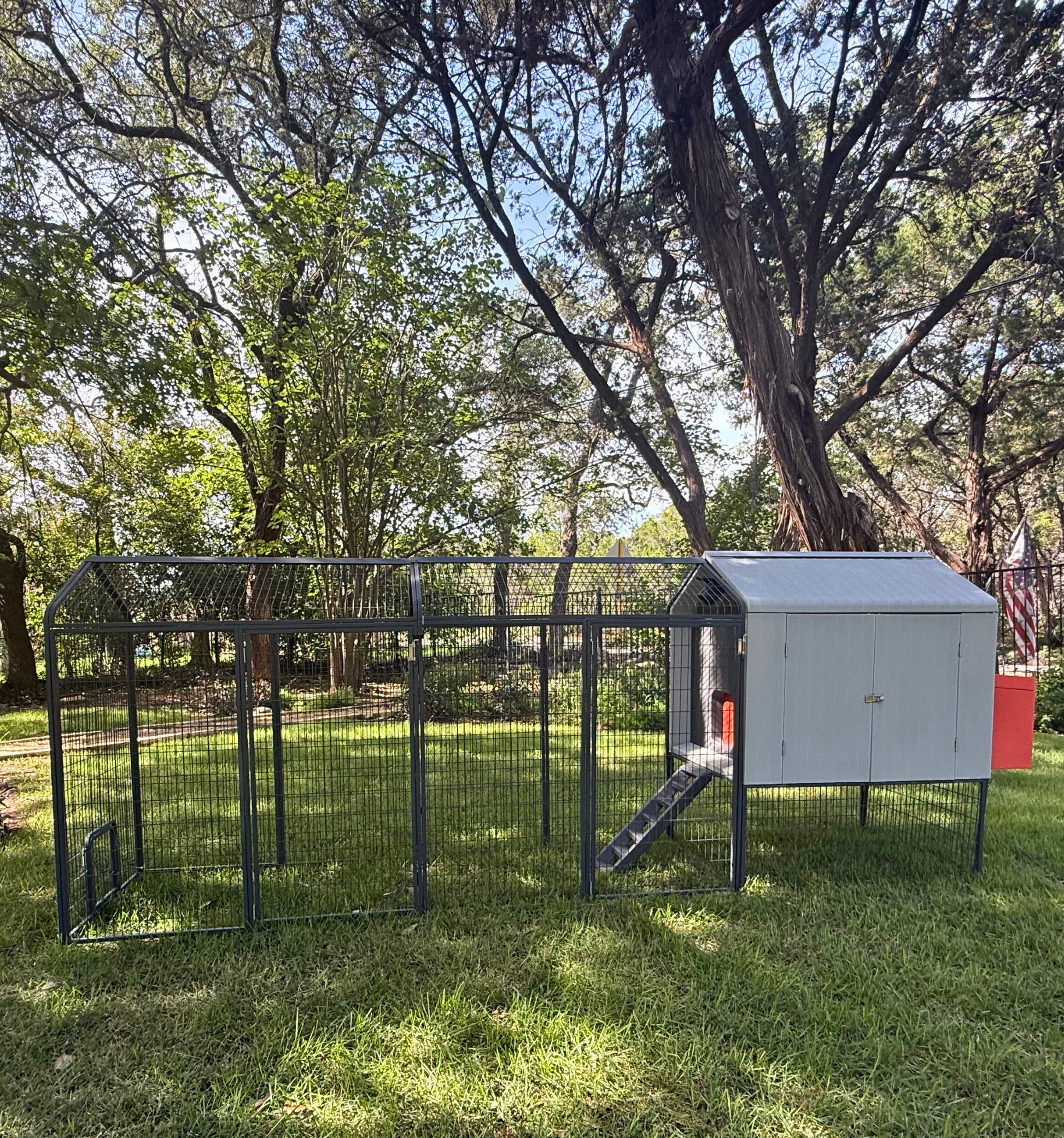 Extended Range Run Add-On for The Smart Coop chicken coop, featuring a spacious outdoor enclosure for poultry.