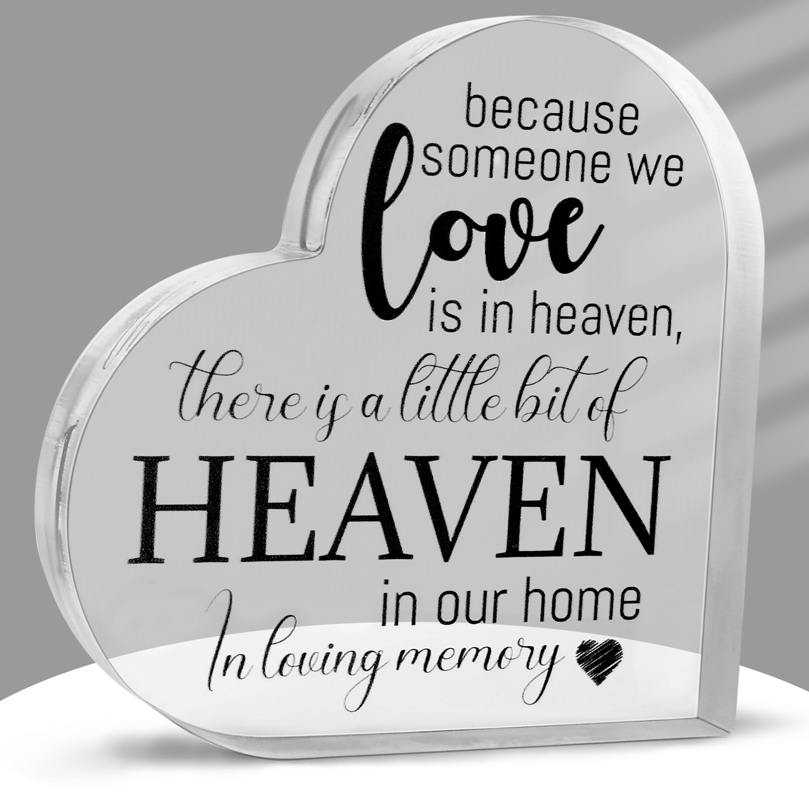 Acrylic memorial heart ornament with engraved "Heaven In Our Home" by The Wind Chime Co, featuring a heartfelt tribute design.
