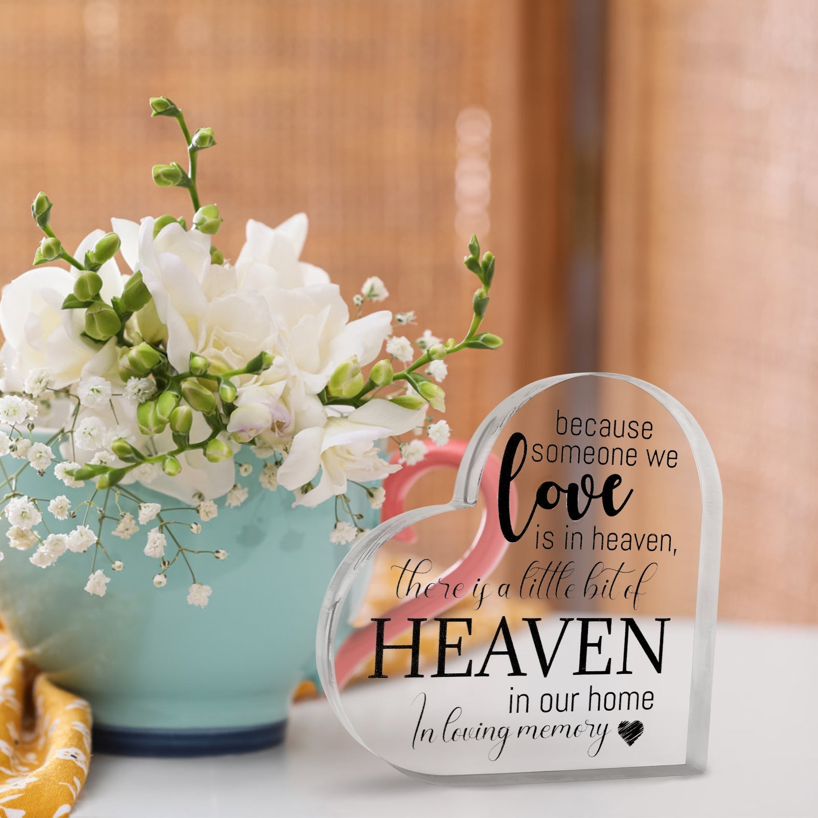 Acrylic memorial heart ornament with "Heaven In Our Home" inscription, designed by The Wind Chime Co, for remembrance and keepsake.