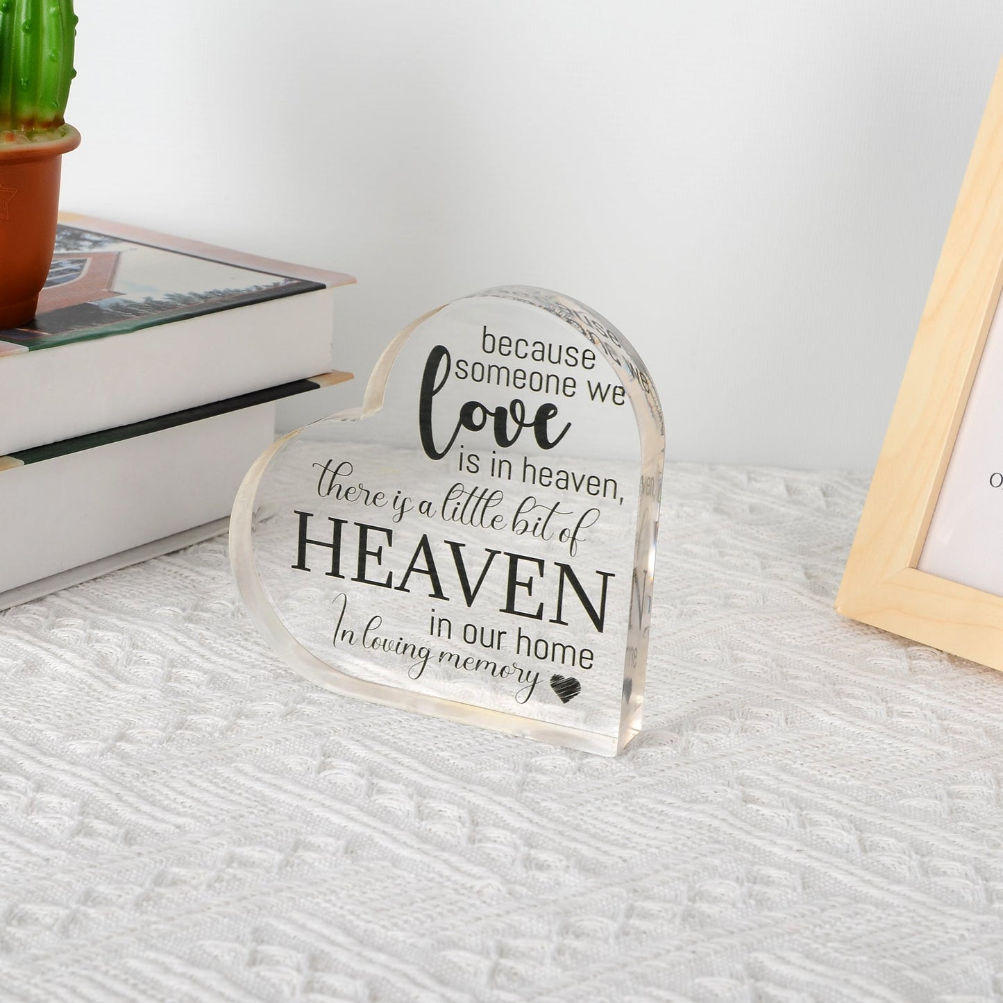 Acrylic memorial heart with "Heaven In Our Home" inscription from The Wind Chime Co, designed as a heartfelt remembrance keepsake.