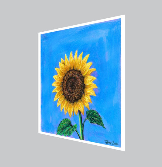 Close-up of Tiffany Bates Art's 8x8 fine art print titled "Soaring Sunflower" featuring vibrant sunflower artwork on textured paper.
