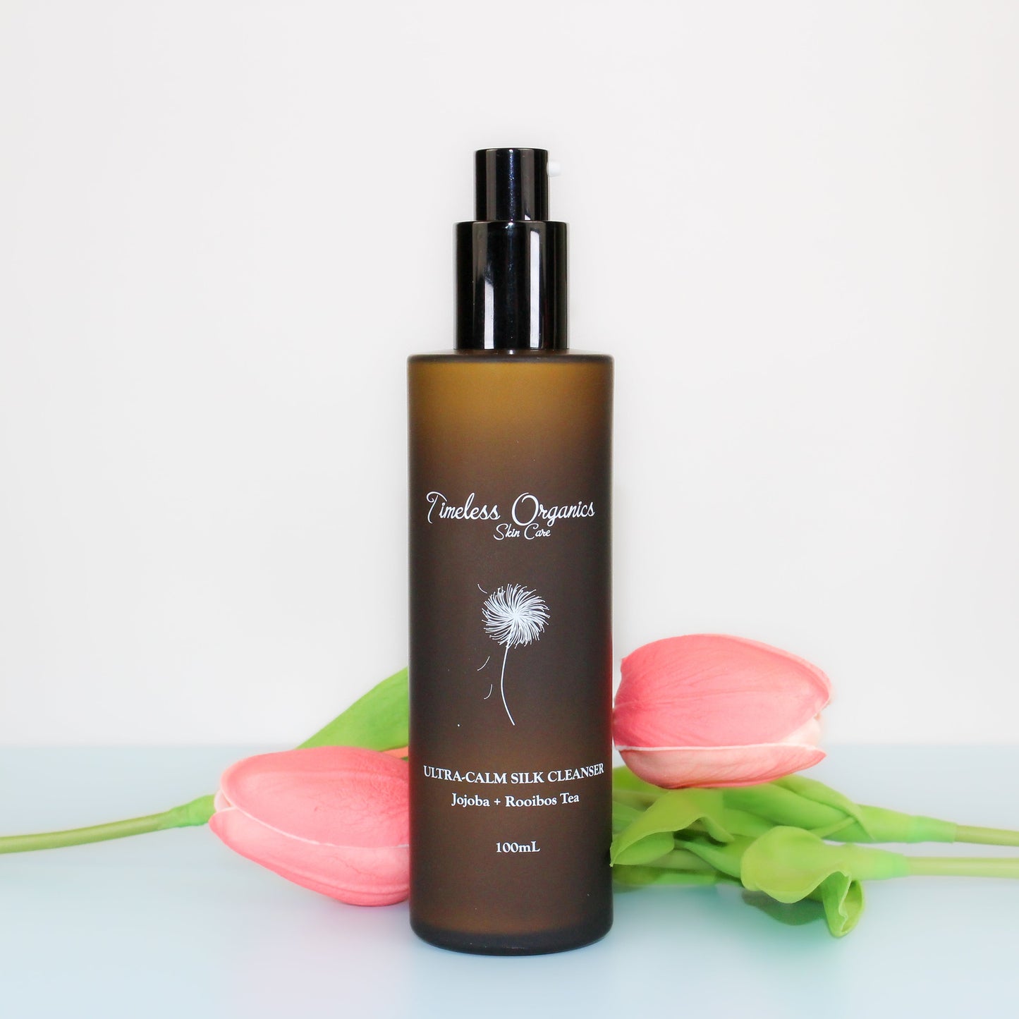 Timeless Organics Ultra-Calm Silk Cleanser in a white bottle, gentle facial cleanser for sensitive skin.