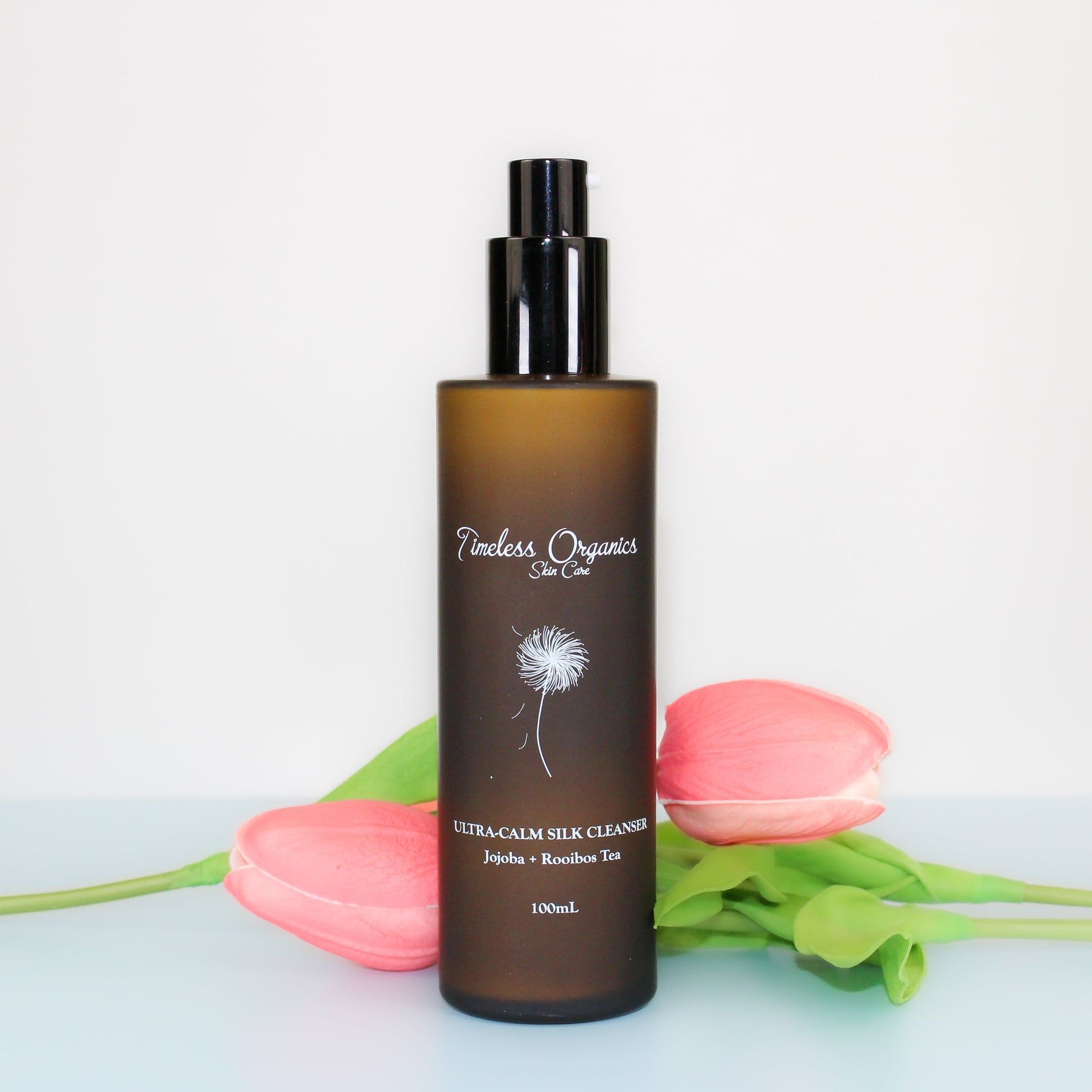 Timeless Organics Ultra-Calm Silk Cleanser in a white bottle, gentle facial cleanser for sensitive skin.