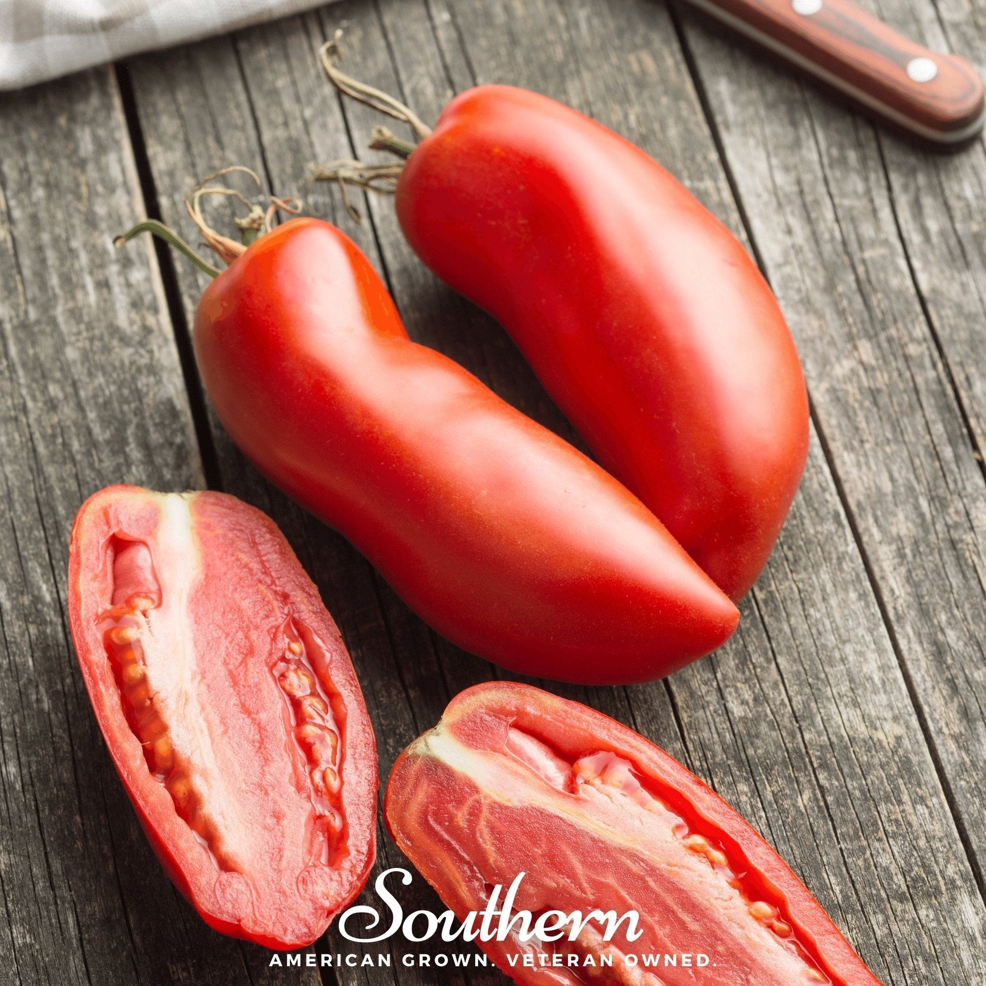 San Marzano tomato seeds from Southern Seeds, showing bright green and ripe red tomatoes on the vine.