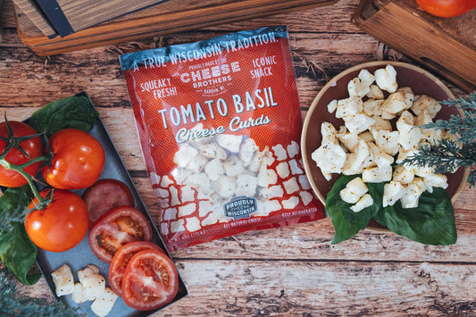 Fresh Tomato Basil Cheese Curds from Cheese Brothers, Inc. showcasing creamy cheese curds with vibrant tomato and basil flavors.
