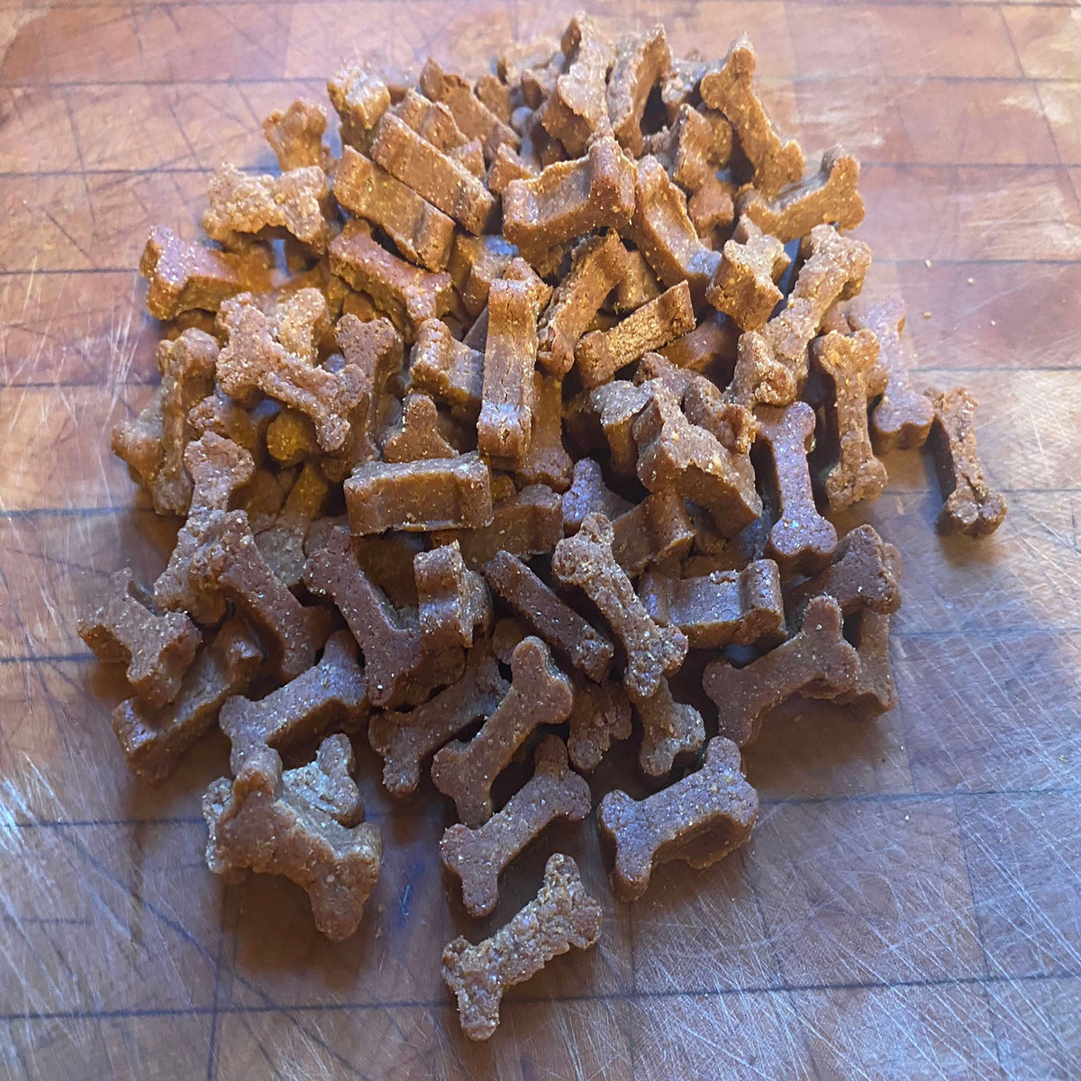 Organic peanut butter dog training treats in a bag from PAWsitively Organic Dog Bakery, perfect for training and rewarding dogs.