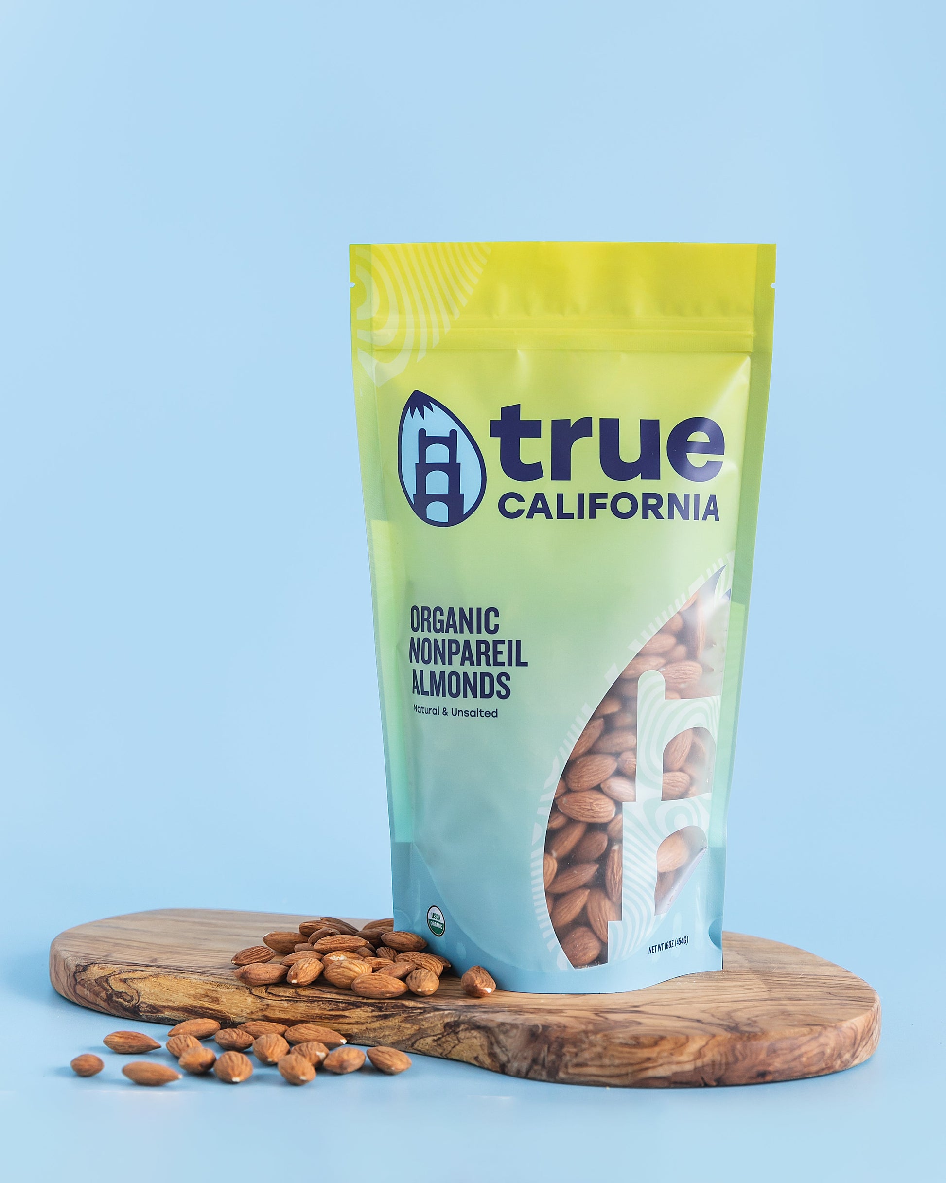 Organic Nonpareil Almonds from True California, 1 lb, close-up of fresh, raw almonds with smooth, light-colored shells.
