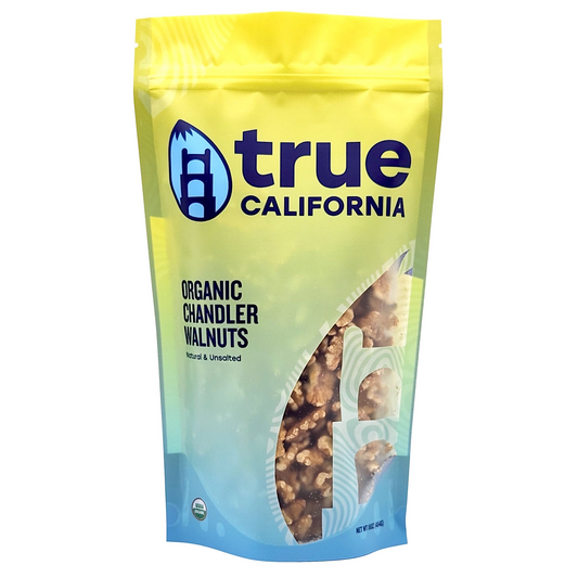 Organic Chandler walnuts from True California, close-up of one-pound bag showing whole, shelled walnuts in natural light.