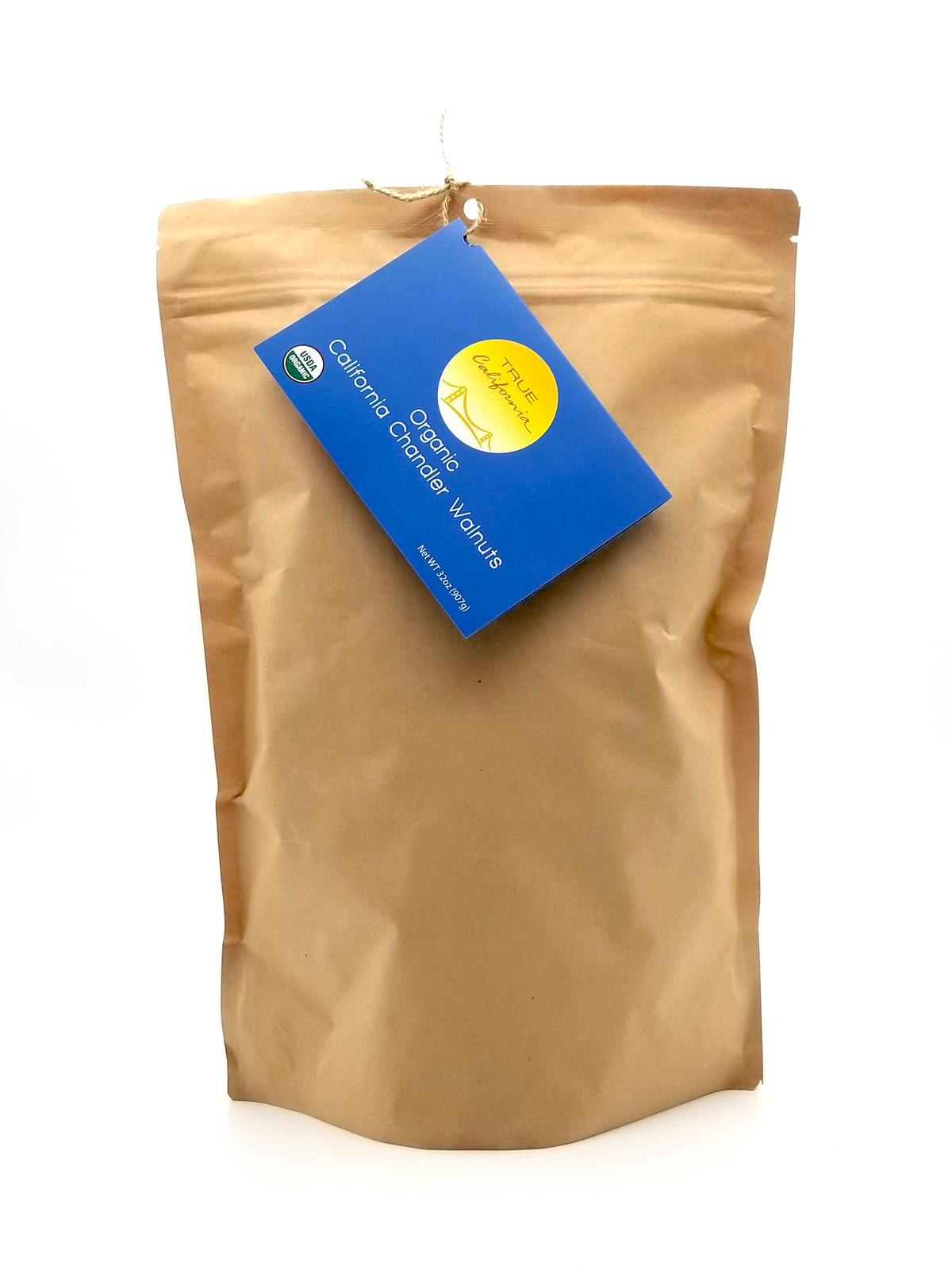 Organic Chandler walnuts from True California, whole and fresh, displayed in a clear view of the 1-pound package.