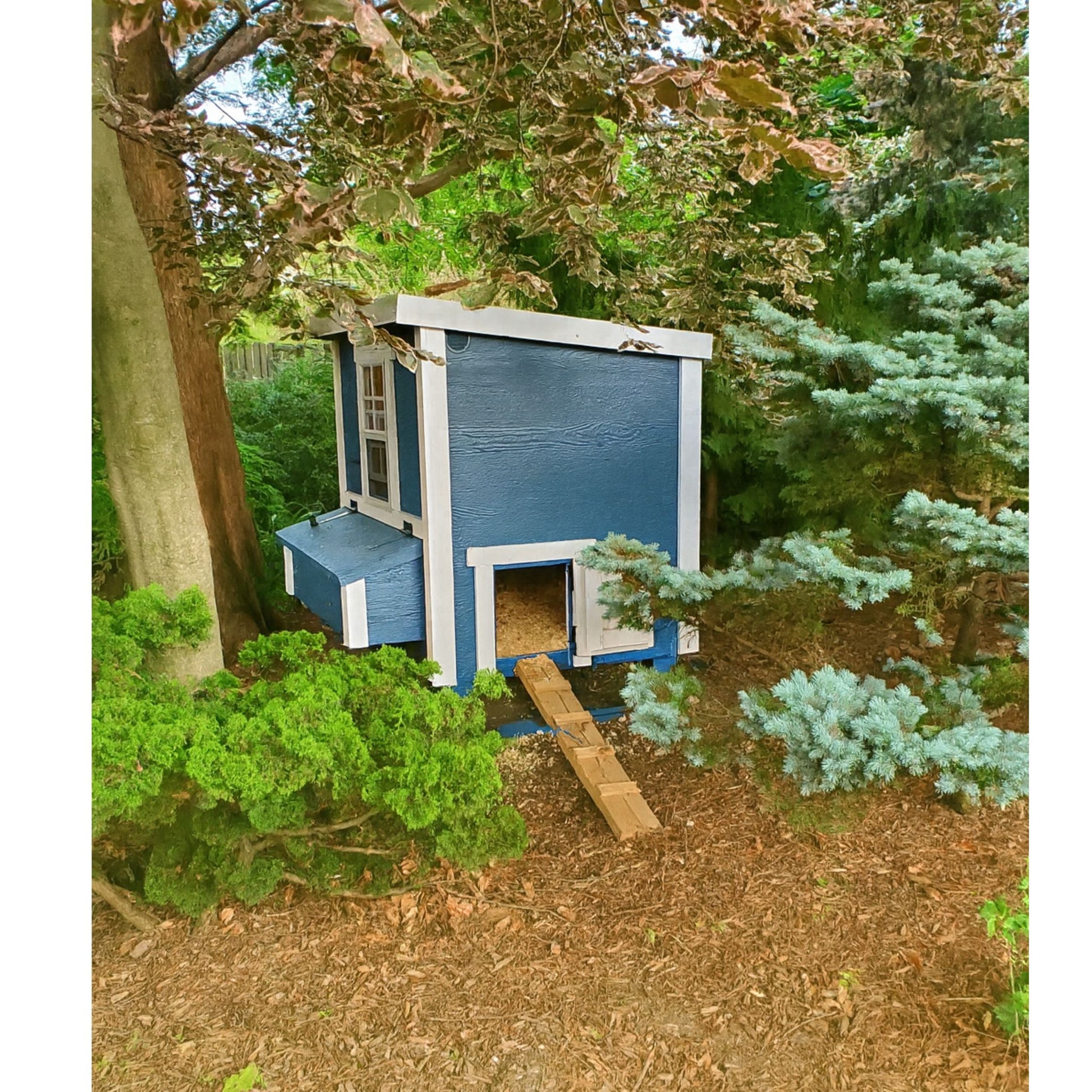 OverEZ Medium Chicken Coop designed for up to 10 chickens, featuring a sturdy wooden structure and secure nesting area.