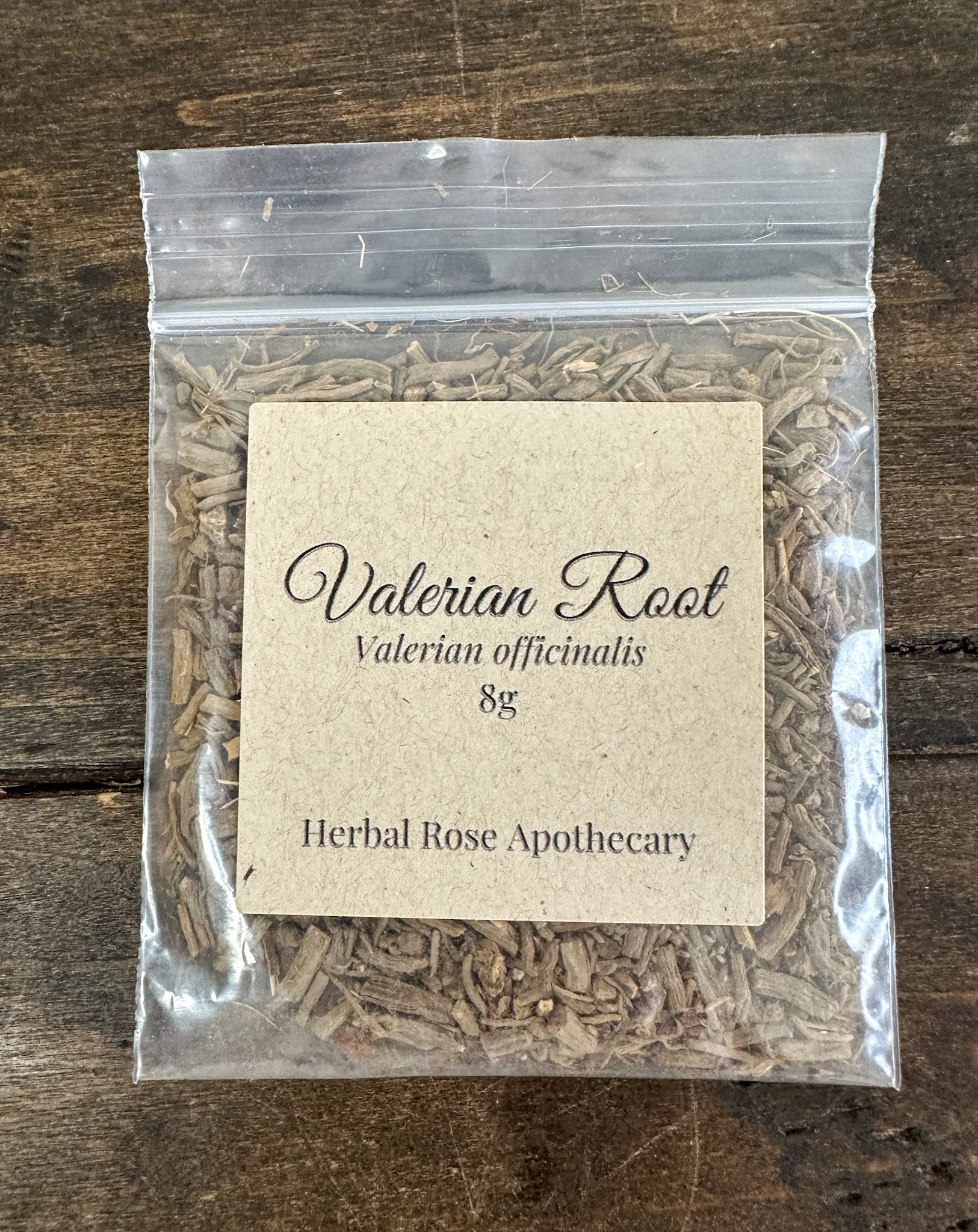 Dried valerian root herbs in an 8g package from HerbalRoseApothecary, showing the earthy, natural herb pieces.