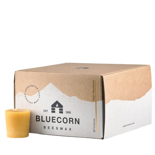 Bluecorn Candles pure beeswax votive candles, showing their warm, natural honey color and smooth cylindrical shape.