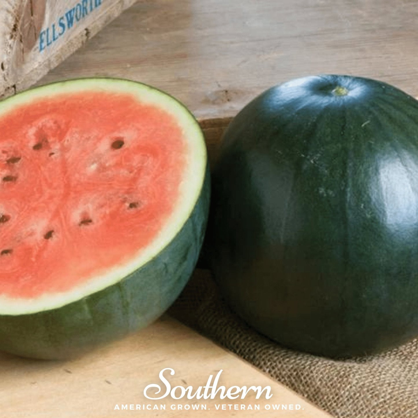 Sugar Baby watermelon seeds from Southern Seeds, small round ripe watermelon fruit with green striped skin and sweet red flesh.