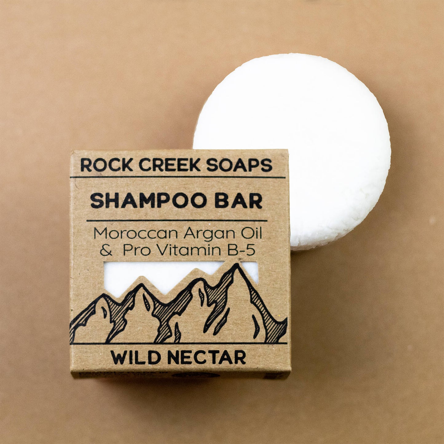 Wild Nectar shampoo bar by Rock Creek Soaps with Vitamin B-5 and Argan Oil, shown in a close-up image.