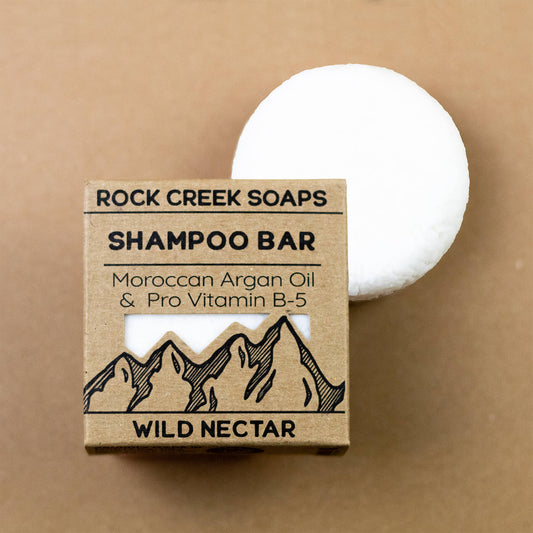 Wild Nectar shampoo bar by Rock Creek Soaps with Vitamin B-5 and Argan Oil, showing the natural soap bar on a neutral background.