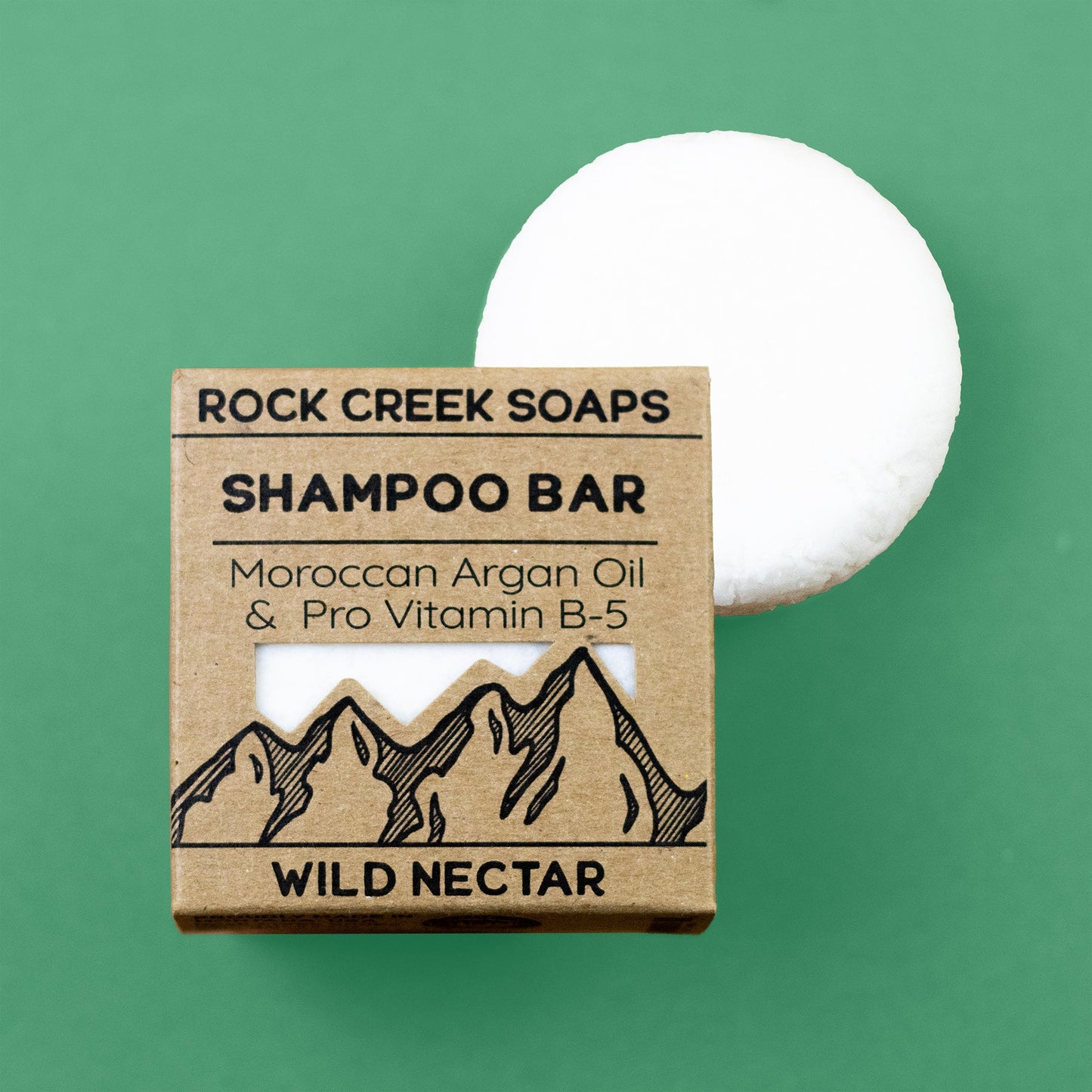 Wild Nectar shampoo bar by Rock Creek Soaps with vitamin B-5 and argan oil, featuring a colorful, natural soap bar on a white background.