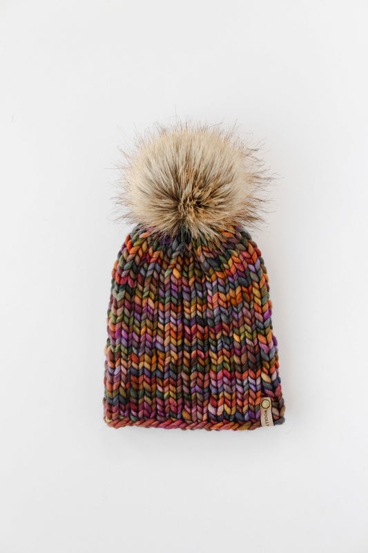 Brown multi-color Merino wool ribbed knit hat with faux fur pom-pom from Woolly Bear Knits.