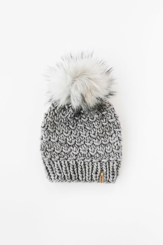 Gray Merino Wool Knit Hat with faux fur pom pom from Woolly Bear Knits, featuring a cozy, textured wool design.