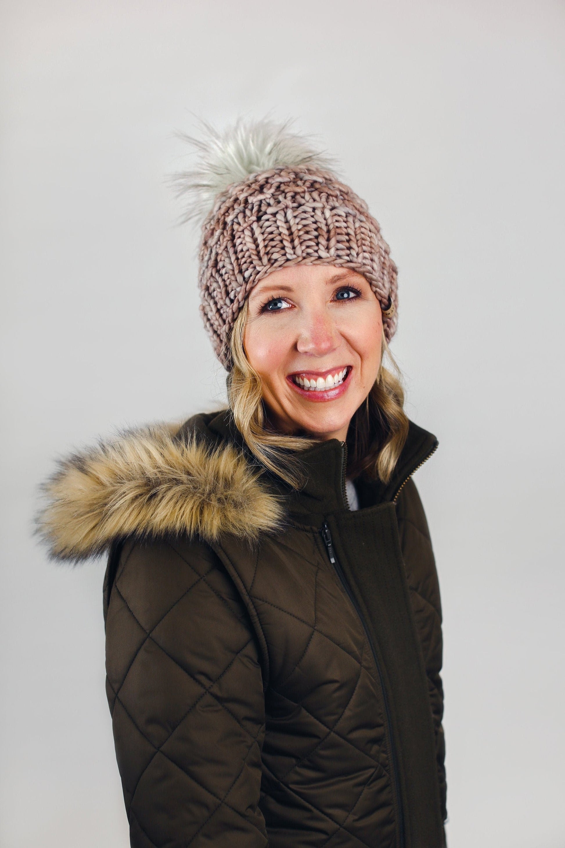 Pearl gray Merino Wool Knit Hat with faux fur pom pom by Woolly Bear Knits, showcasing a cozy, stylish winter accessory.