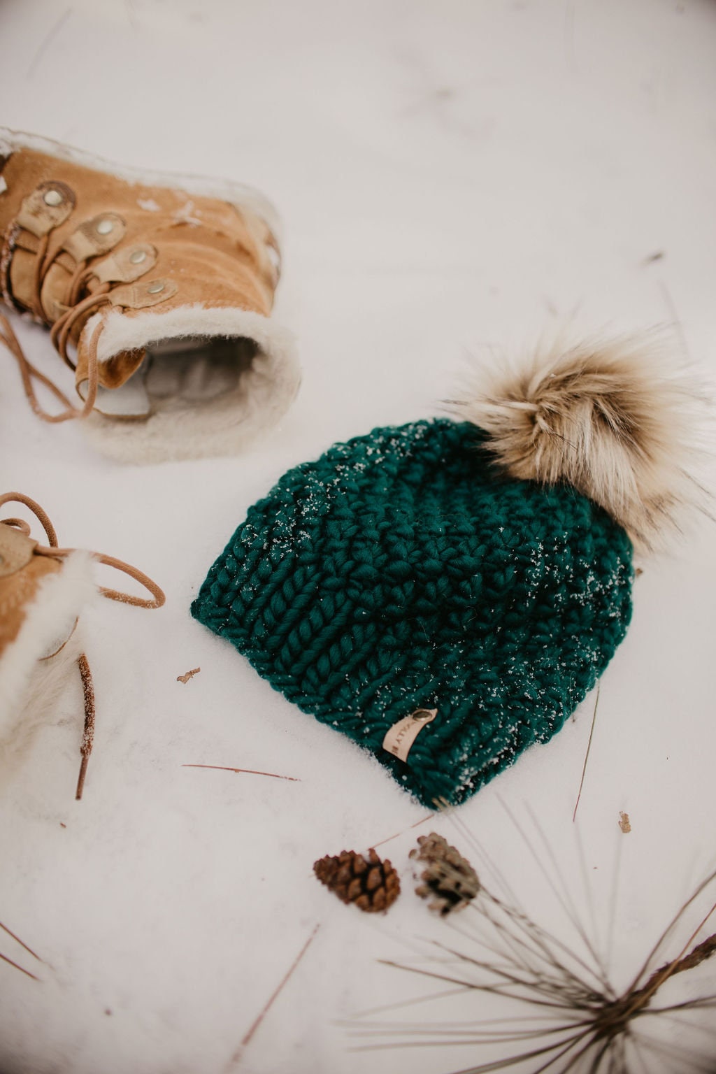 Forest green Peruvian wool knit hat by Woolly Bear Knits with faux fur pom pom, cozy and stylish winter accessory.