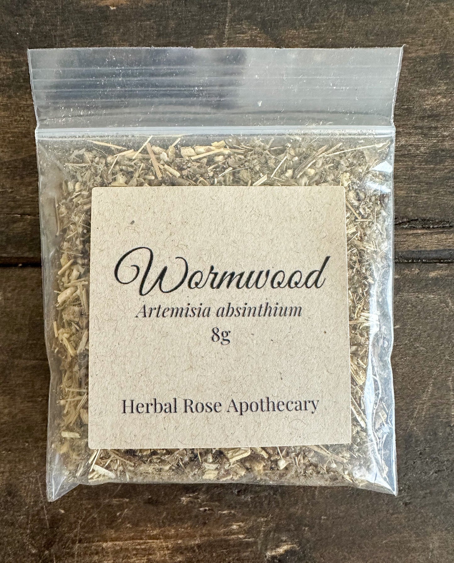Dried wormwood herb from herbalroseapothecary in an 8g package, showcasing leafy green wormwood leaves for herbal remedies.