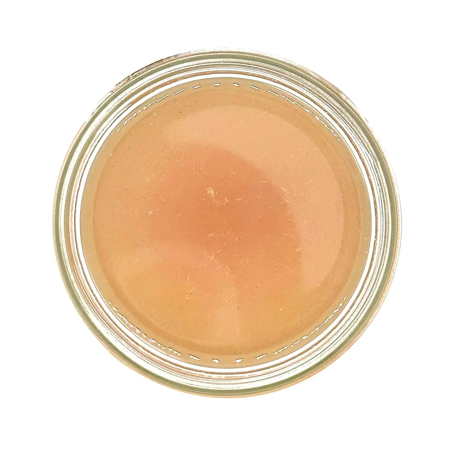 Bottle of Your Only Earth Rose Coconut Oil showing the label and clear liquid inside, highlighting natural skincare product.