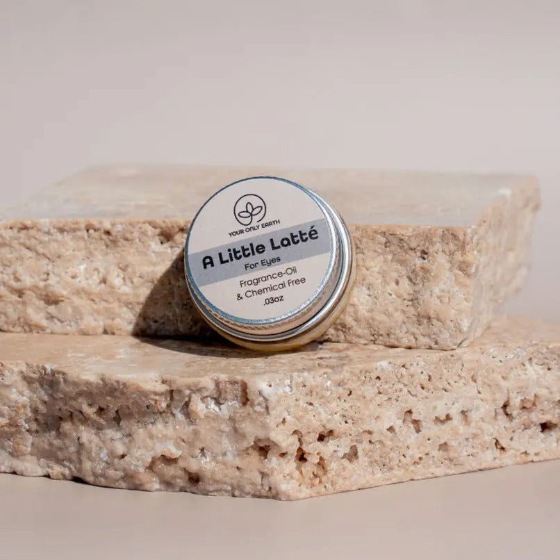 Your Only Earth A Little Latté eye balm for skin care, featuring a small jar with soothing eye treatment product and natural ingredients.