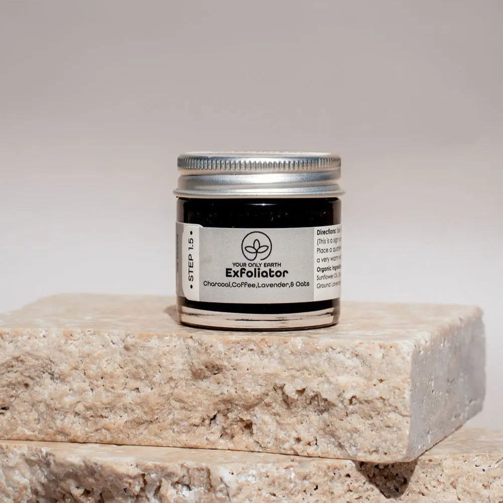 Your Only Earth skin care exfoliator with natural ingredients, showing a jar of the exfoliating scrub with textured surface.