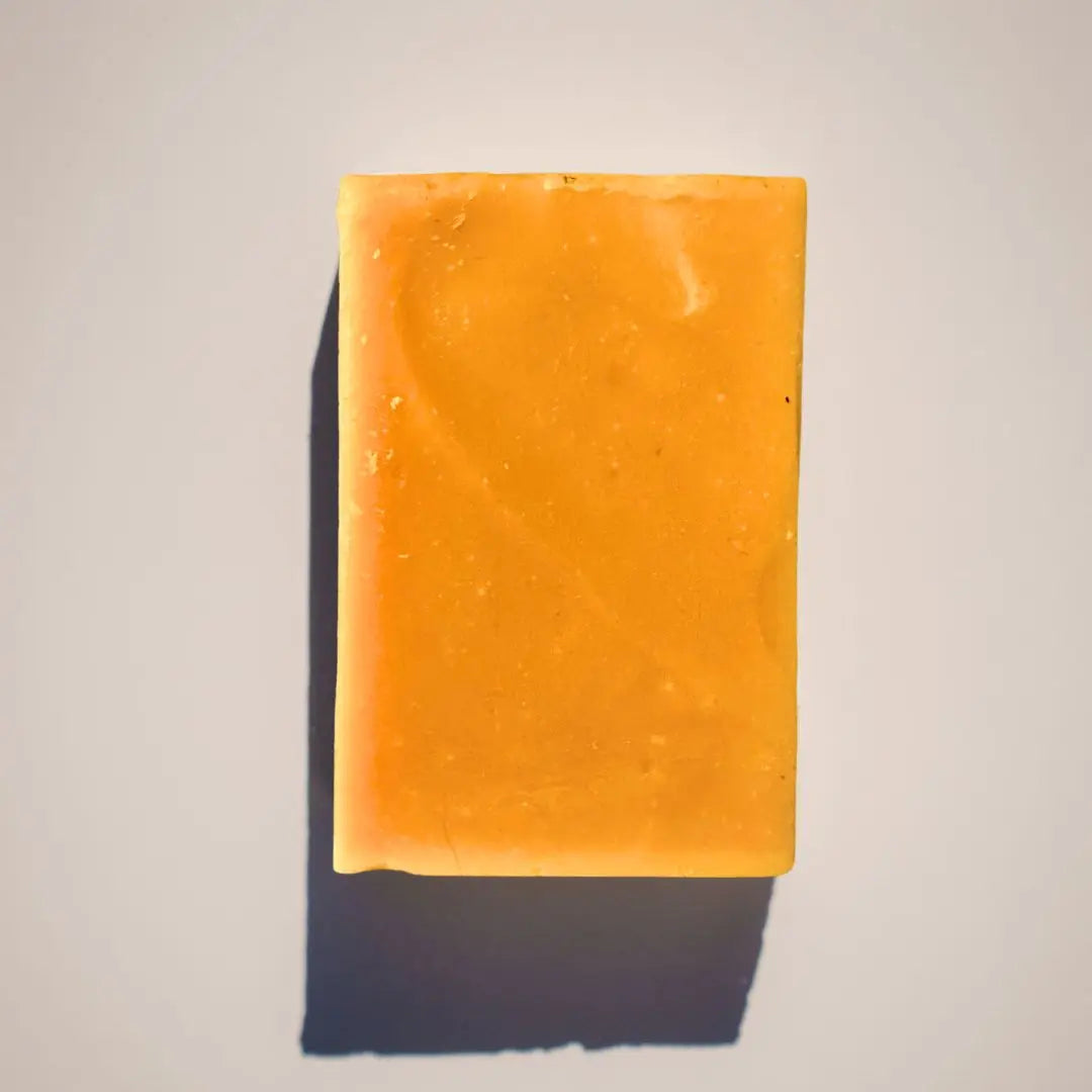 Natural turmeric soap bar by Your Only Earth, showcasing its golden color and smooth texture, ideal for skincare.