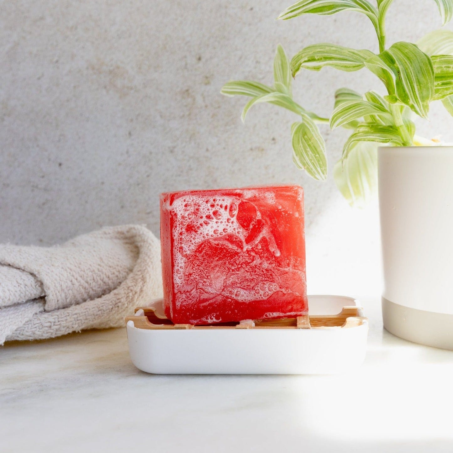 Zero Waste Glycerin Soap Bar by Suds & Eco, 4.5oz, showing a bright yellow soap bar with clear glycerin texture.