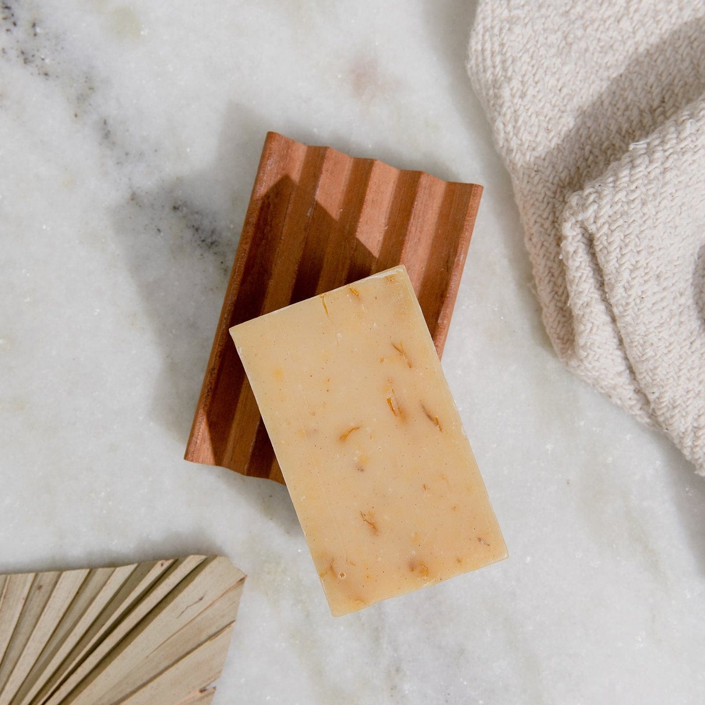 Turmeric soap bar by ZeroWasteStore.com, 4oz all-natural vegan face and body soap with six scent options, plastic-free packaging.