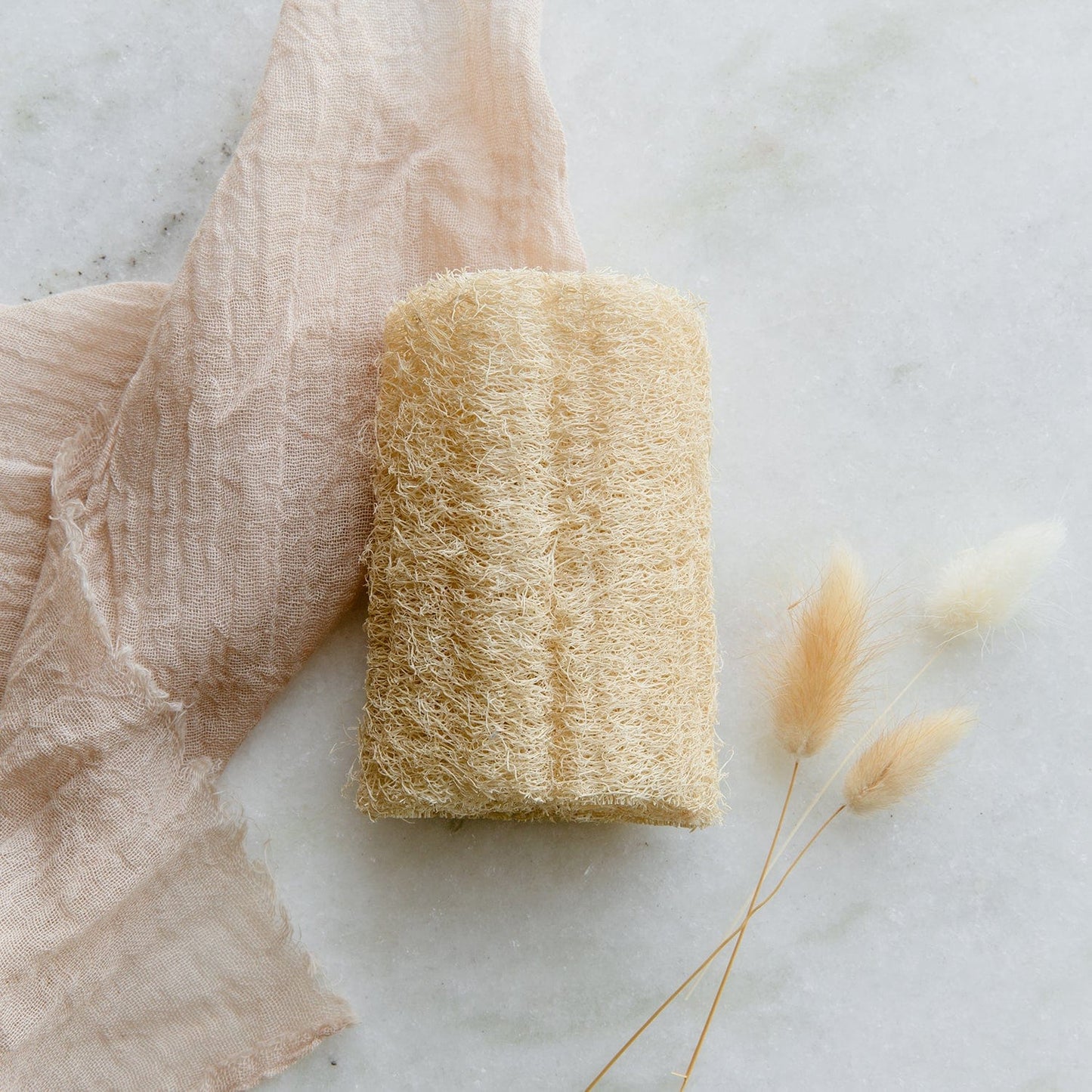 Pack of three natural loofah sponges for bathing from ZeroWasteStore.com, ideal for exfoliating and gentle skin cleansing.