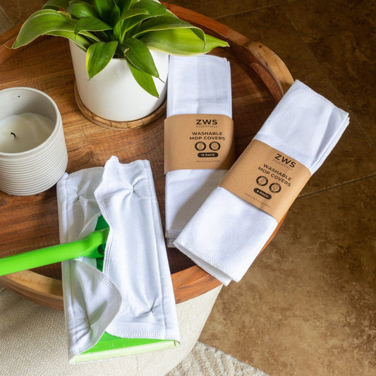 Six white washable mop covers for cleaning tools by ZeroWasteStore.com, reusable and eco-friendly cleaning accessories.