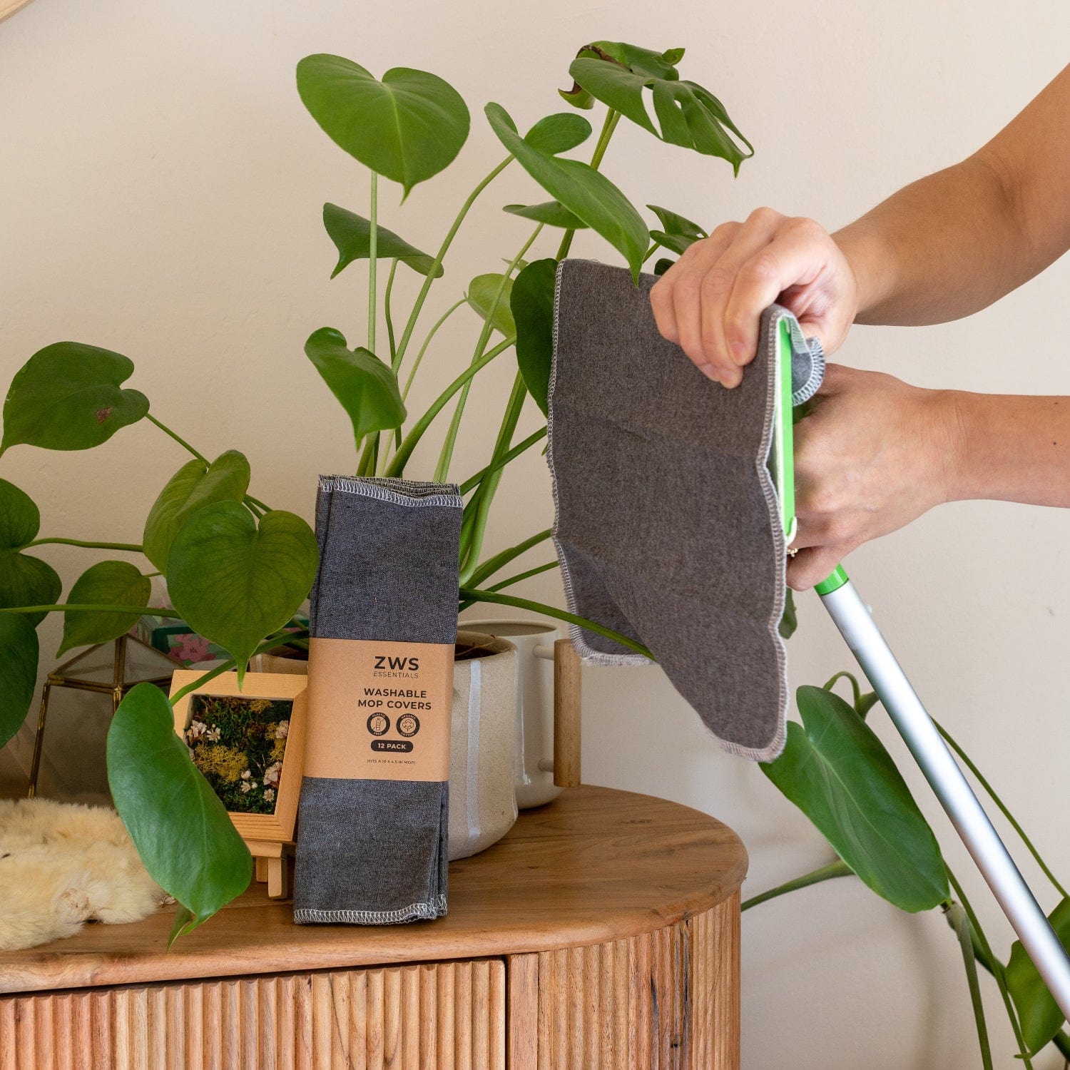 Six white washable mop covers from ZeroWasteStore.com, reusable cleaning tools for eco-friendly floor cleaning.