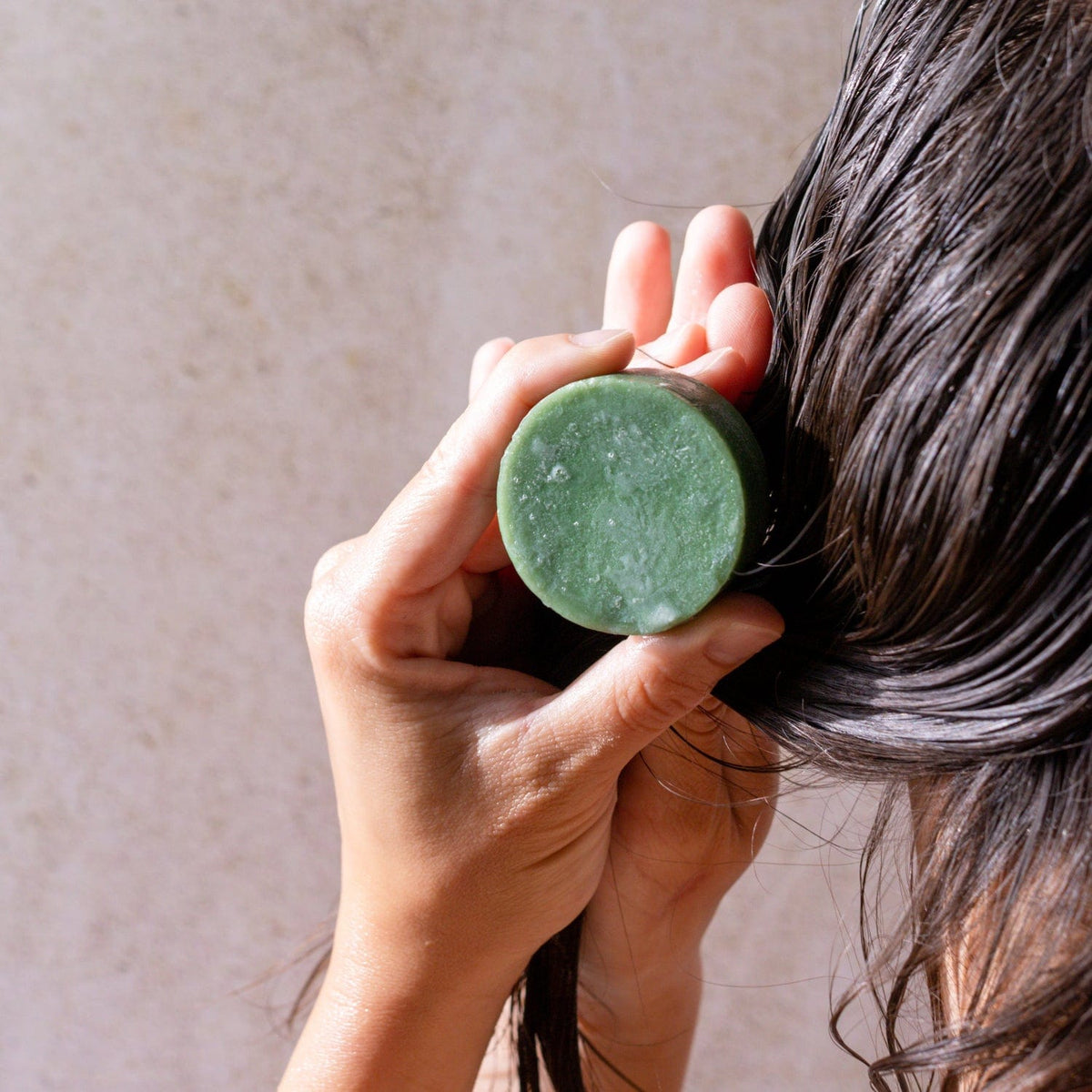 Bloom Castor Oil Conditioner Bar from ZeroWasteStore for stronger, softer, healthier hair, shown in a natural soap-like bar form.