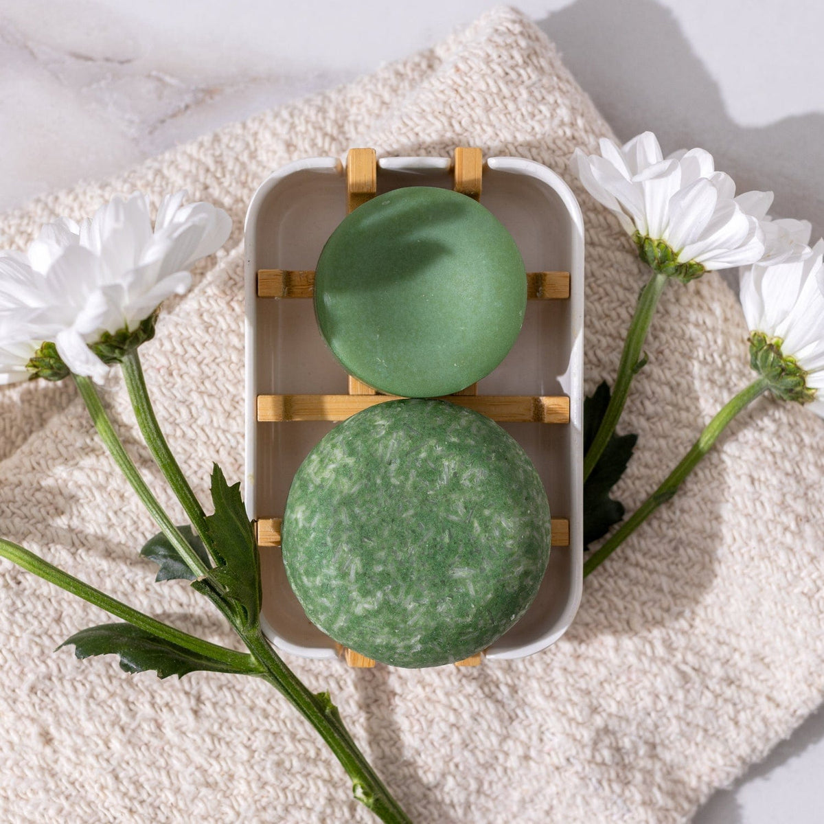 Bloom Castor Oil Conditioner Bar by ZeroWasteStore.com for stronger, softer, healthier hair, shown in eco-friendly packaging.