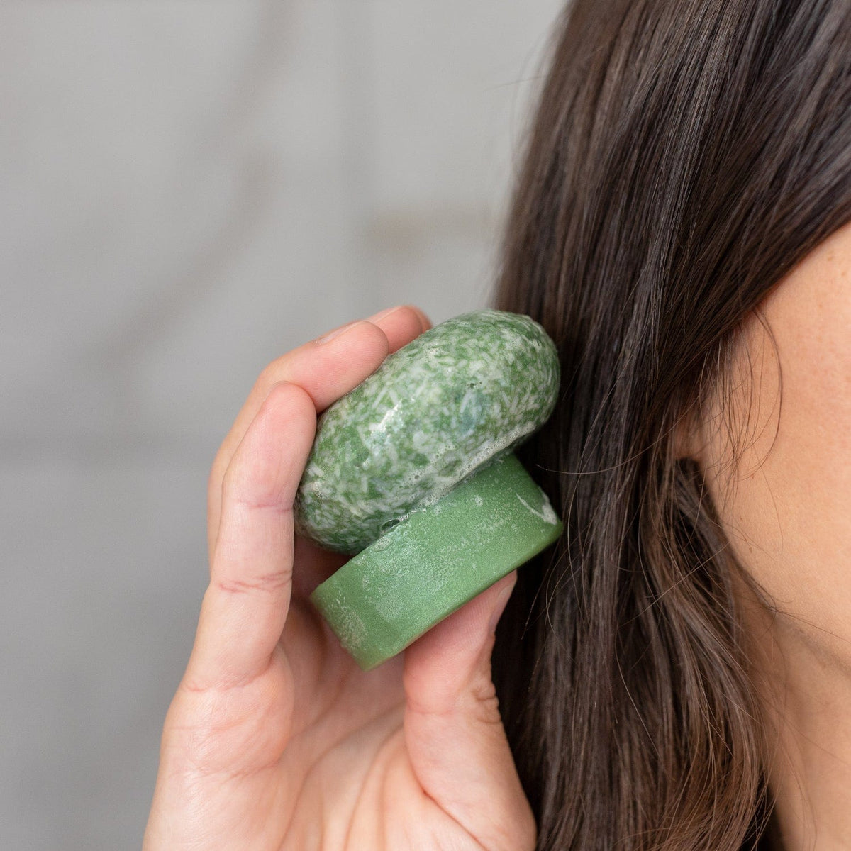 ZeroWasteStore Bloom Castor Oil Conditioner Bar for stronger, softer, healthier hair, shown in a natural soap-like form.