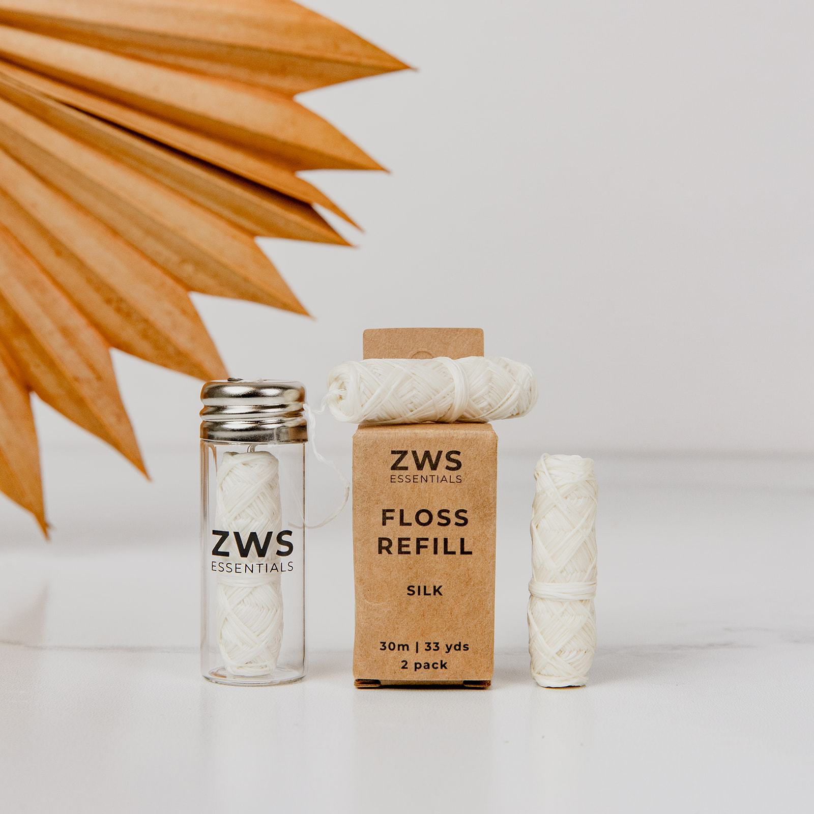 Silk Floss Zero Waste Dental Floss by ZeroWasteStore.com, biodegradable, 30m, refillable, eco-friendly dental floss in a natural setting.