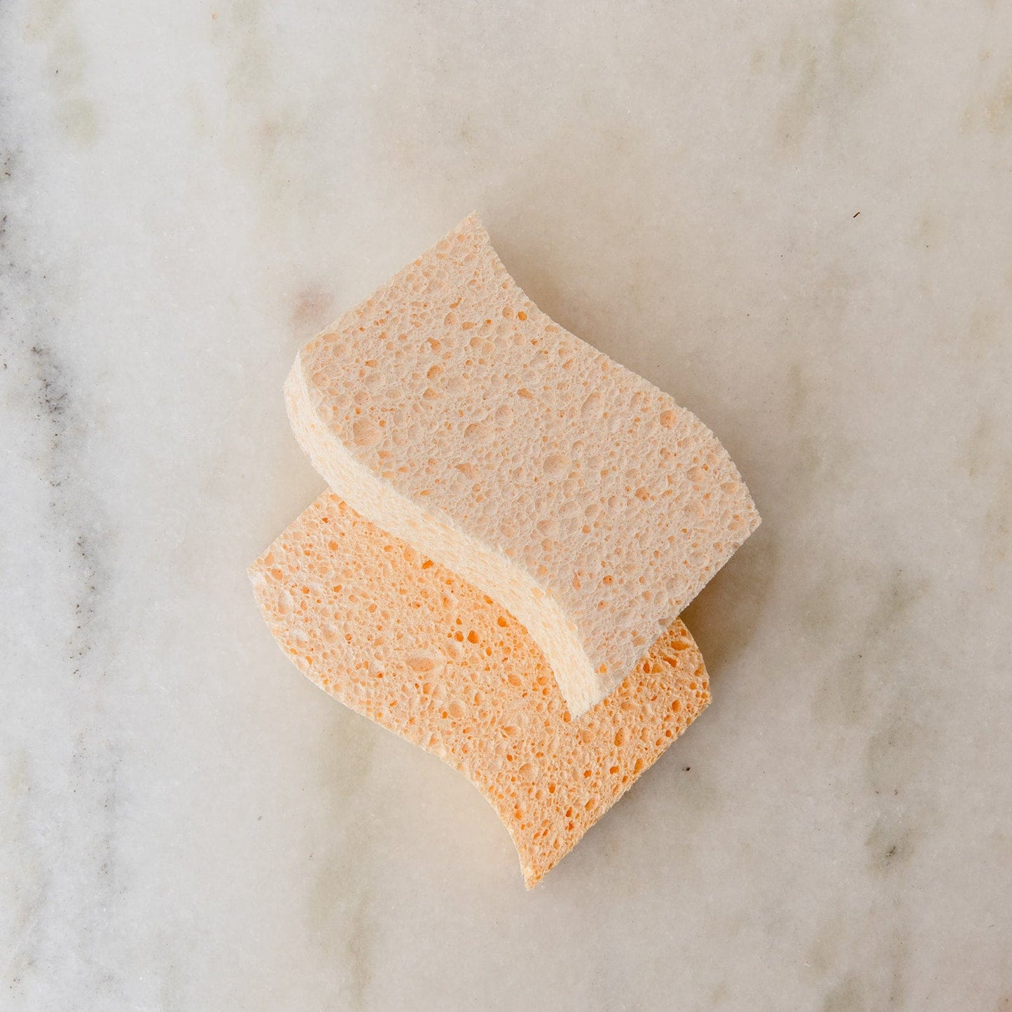 Two cellulose kitchen sponges from ZeroWasteStore.com for household cleaning, shown in a 2-pack.