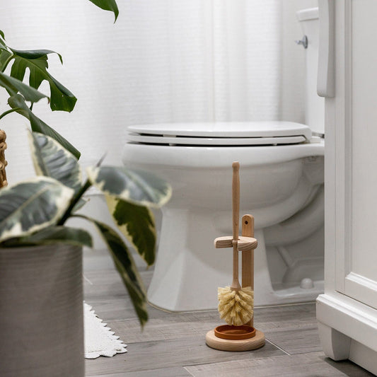 Plastic-free toilet brush with stand from ZeroWasteStore.com, eco-friendly household cleaning supply for bathroom use.