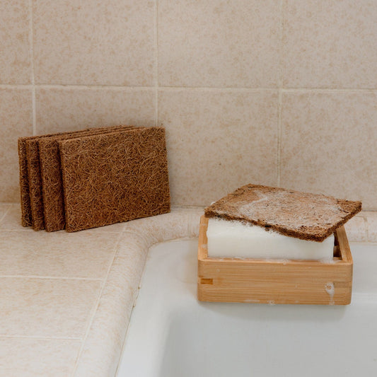 Coconut kitchen scrubber from ZeroWasteStore.com, eco-friendly household cleaning tool with natural fibers for scrubbing dishes.