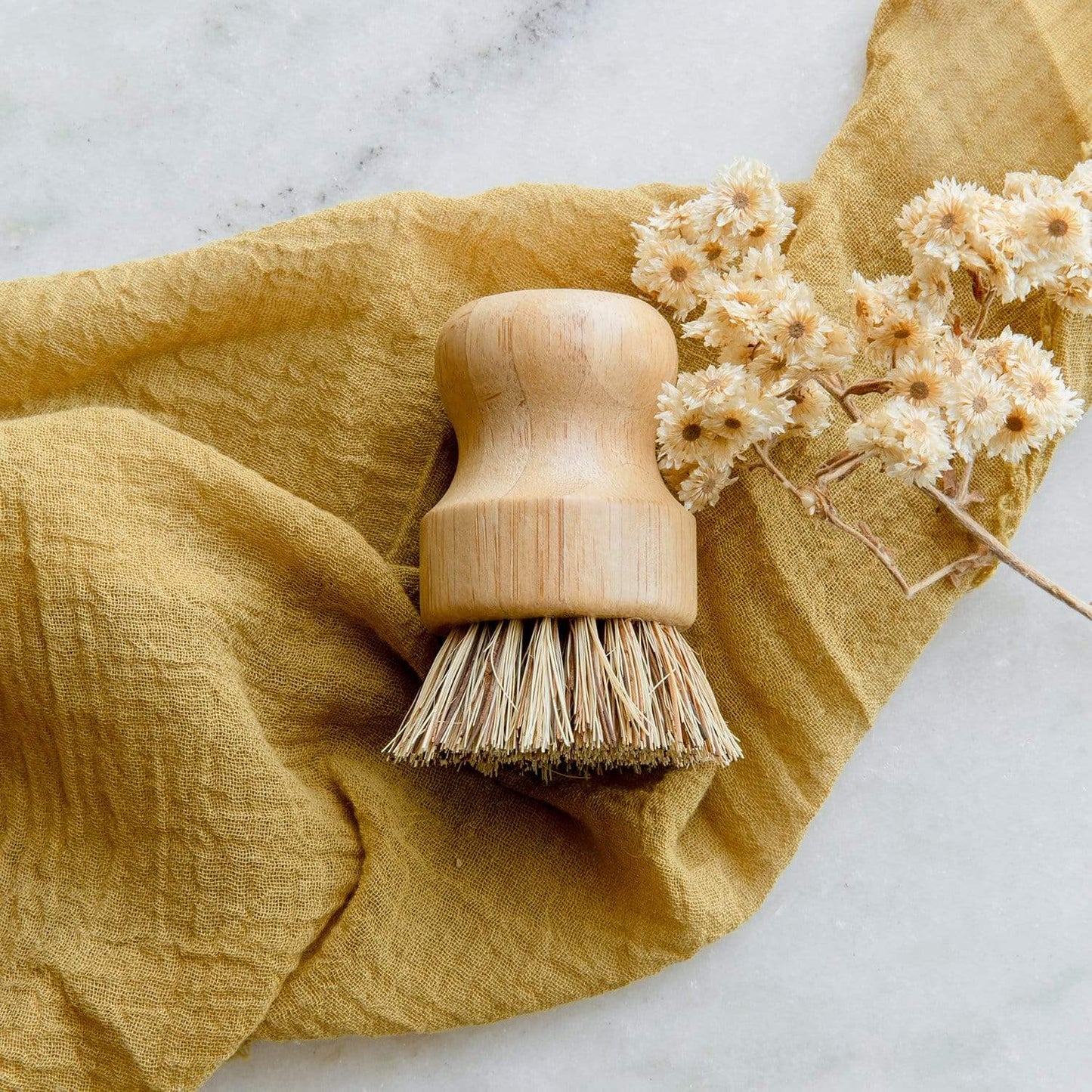 Eco-friendly bamboo pot scrubber from ZeroWasteStore, plastic-free and compostable household cleaning brush for eco-conscious cleaning.