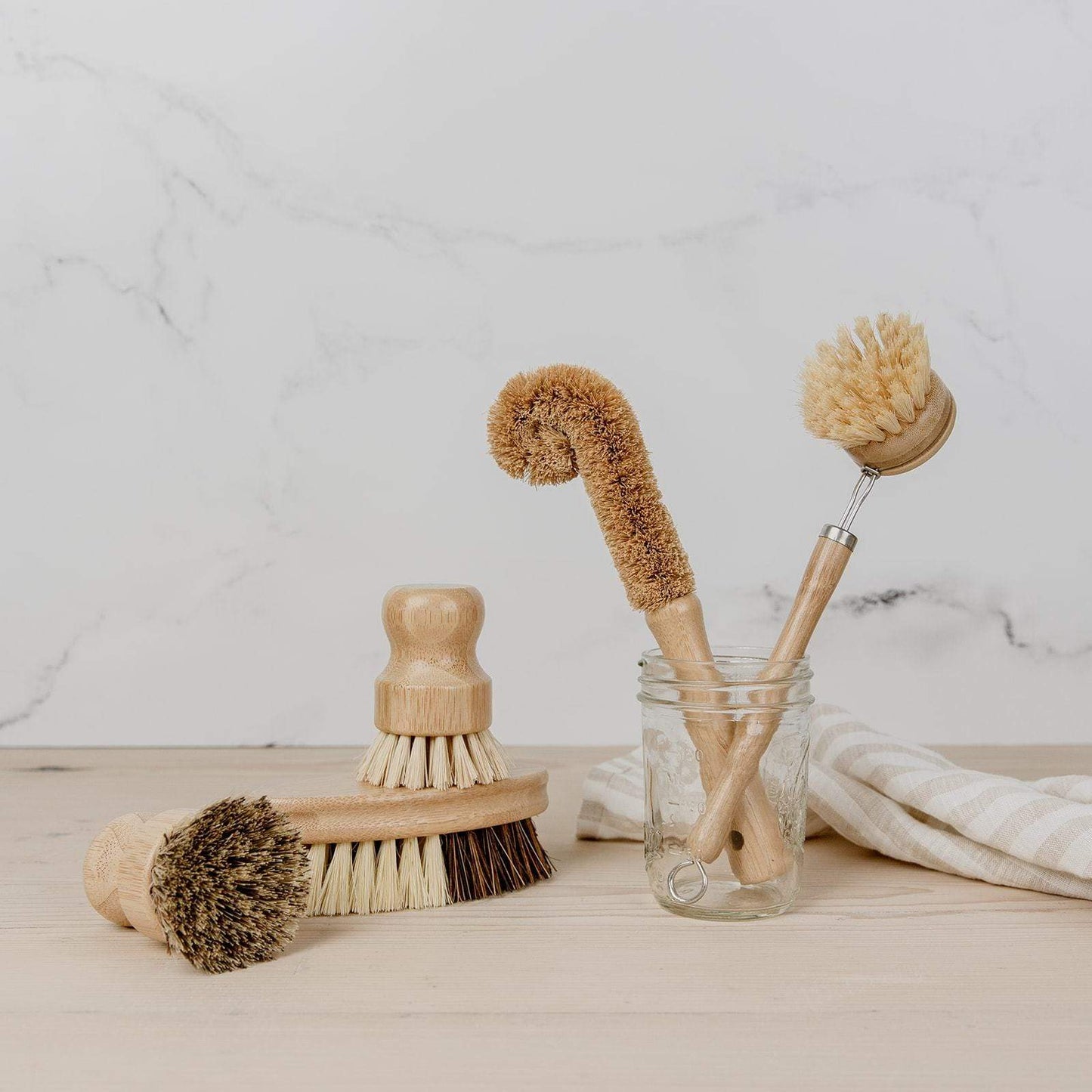 Eco-friendly bamboo pot scrubber from ZeroWasteStore, plastic-free and compostable household cleaning brush for kitchen use.